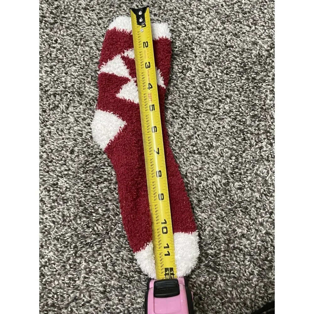 New red,white fuzzy holiday slipper socks feature a geometric diamond pattern